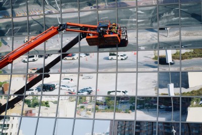 The crane is the main element of the construction process, while the work is carried out at height